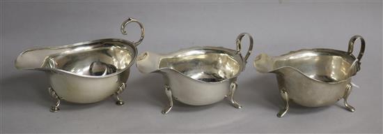 A pair of 1950s silver sauceboats and an earlier silver sauceboat. 9.5 oz.